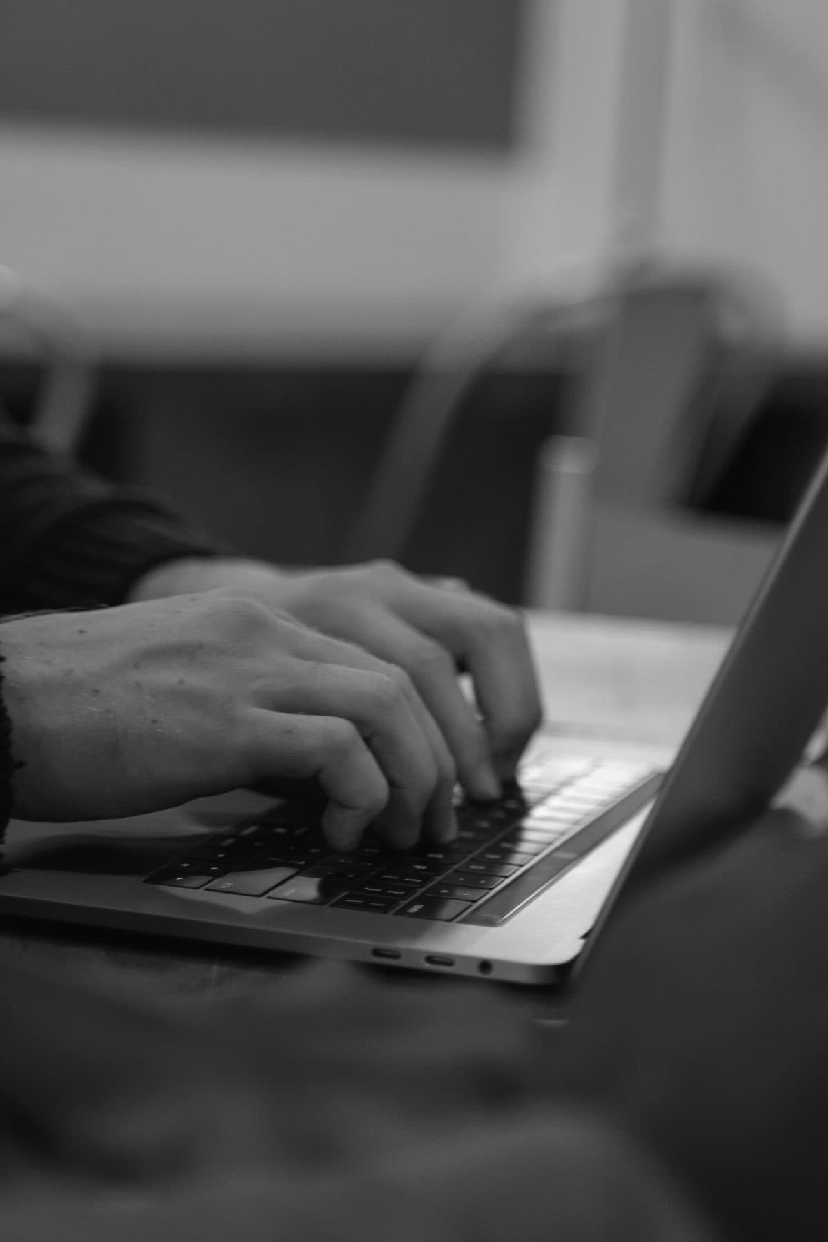 A Zeal specialist typing at a laptop